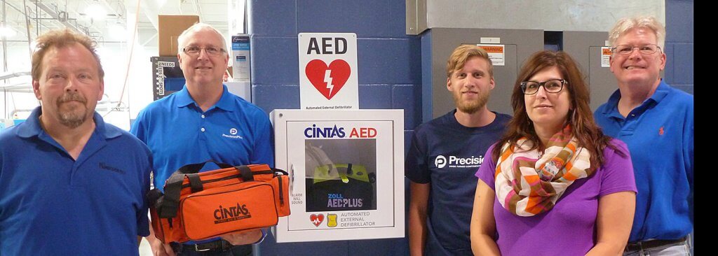 Our dedicated Safety Committee with the new AED unit. Pictured left to right: Tom Lankford, Production Manager; Neil Fleischhacker, Facilities Manager; Austin Majewski, Materials Specialist; Mary Spaight, HR Administrator; and Ray Van Pamel, Swiss Technician. Missing from photo: Bill Wells, Director of Sales & Engineering.