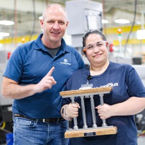 March Pillar Among Peers Recipient Esmeralda pictured with COO Dave Strand